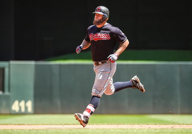 Cleveland Indians&#39 Mike Napoli rounds the bases after hitting a home run against Minnesota Twins pitcher Kyle Gibson during the second inning of a baseball game Sunday