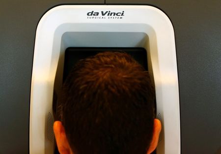 A surgeon views three-dimensional image on da Vinci Xi Surgical System made by Intuitive Surgical during demonstrated of surgery robot at Palomar Medical Center in Escondido California