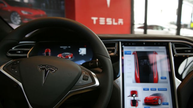 Investigators say Tesla car was speeding at time of crash