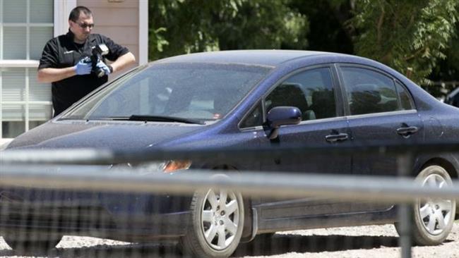 Investigators work at the scene of a home in suburban Phoenix Arizona where multiple bodies were found on Tuesday