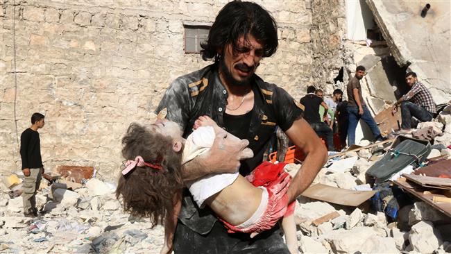 A Syrian man carries a child who was retrieved under the rubble of a collapsed building following a US airstrike on Sakhur in the northern city of Aleppo