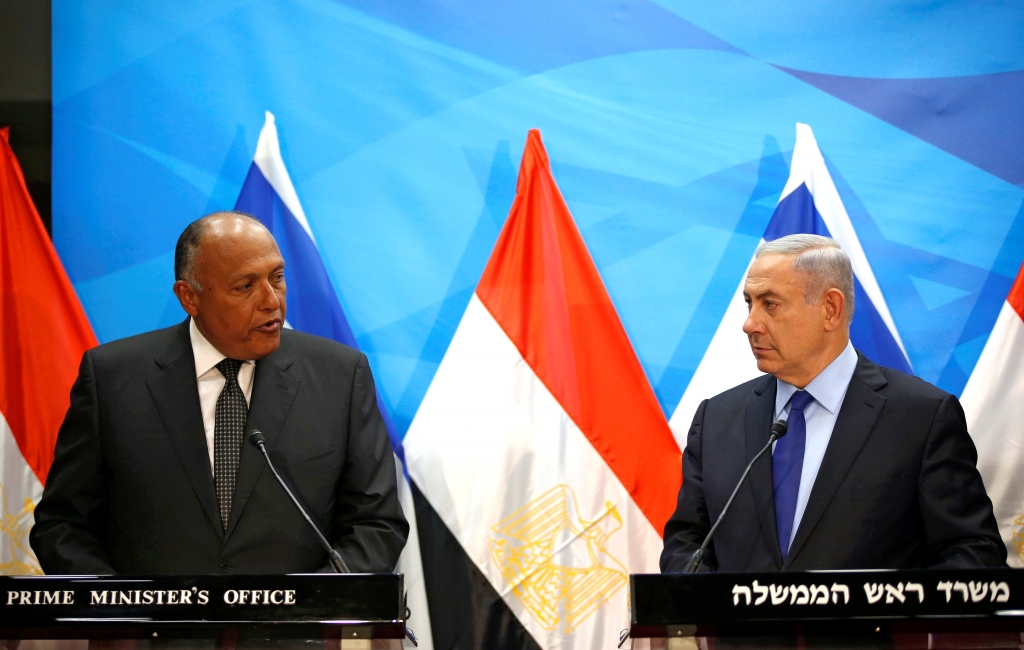 Israeli Prime Minister Benjamin Netanyahu welcomes Egypt’s Foreign Minister Sameh Shoukry left in Jerusalem on Sunday. — Reuters