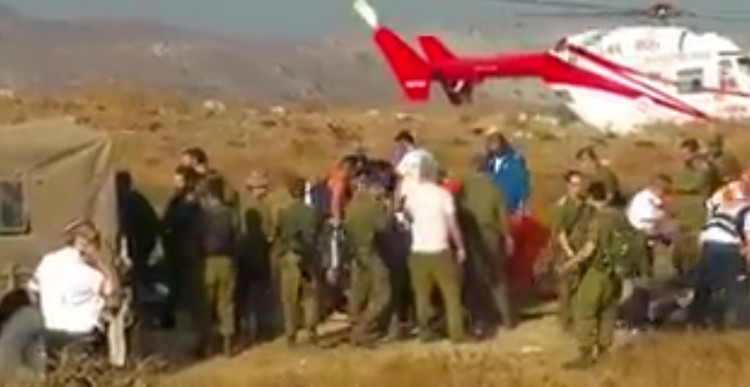 Army personnel gather at the scene after two soldiers were killed in an apparent training accident on the Golan Heights