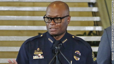 Dallas Mayor Mike Rawlings looks on during a press conference at Dallas City Hall as Dallas Police Chief David Brown speaks on the fatal shootings of five police officers