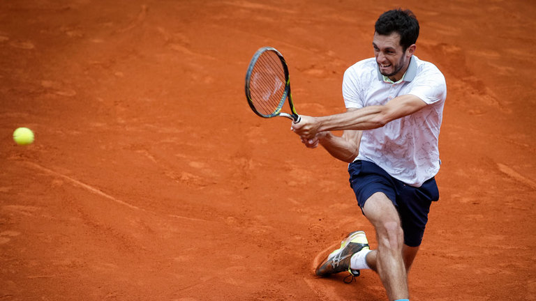 James Ward stretches in vain during his straight sets defeat in Belgrade