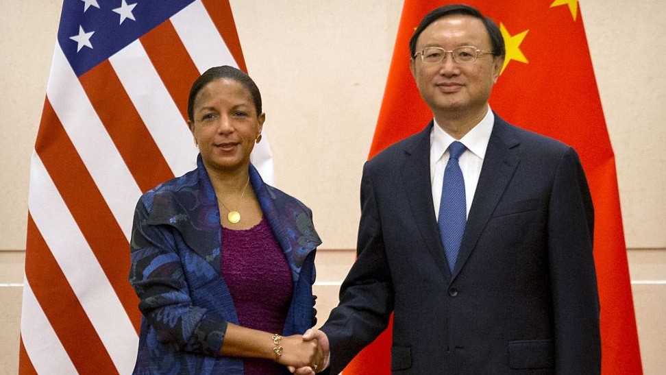 U.S. National Security Adviser Susan Rice left and Chinese State Councilor Yang Jiechi right shake hands as they pose for