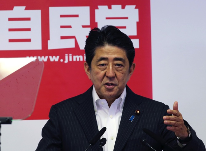 Japanese Prime Minister and leader of the ruling Liberal Democratic Party Shinzo Abe speaks during a press conference in Tokyo yesterday