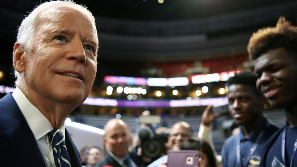 Vice President Joe Biden talks to students from Eagle Academy for Young Men during a walk at the Democratic National Convention Tuesday. He speaks Wednesday night