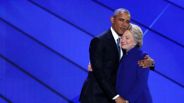 Democratic Presidential nominee Hillary Clinton hugs President Barack Obama after joining him on stage during the third day of the Democratic National Convention in Philadelphia, Wednesday