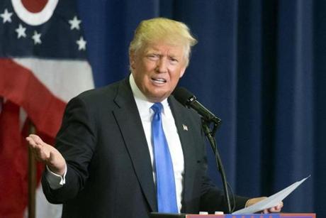 Republican presidential candidate Donald Trump reacts as he speaks about former Secretary of State Hillary Clinton's email issues during a campaign rally at the Sharonville Convention Center Wednesday