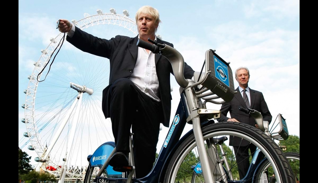 Boris Johnson Mayor of London left with the Chairman of Britain's Barclays Bank Marcus Agius as they poses for the media as a new cycle hire scheme starts in London