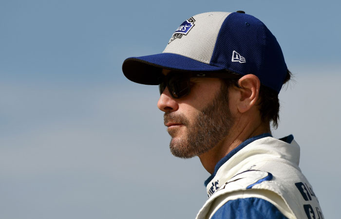 Jimmie Johnson driver of the #48 Lowe’s Chevrolet stands on the grid during qualifying for the NASCAR Sprint Cup Series New Hampshire 301 at New Hampshire Motor Speedway in Loudon New Hampshire Friday. — AFP