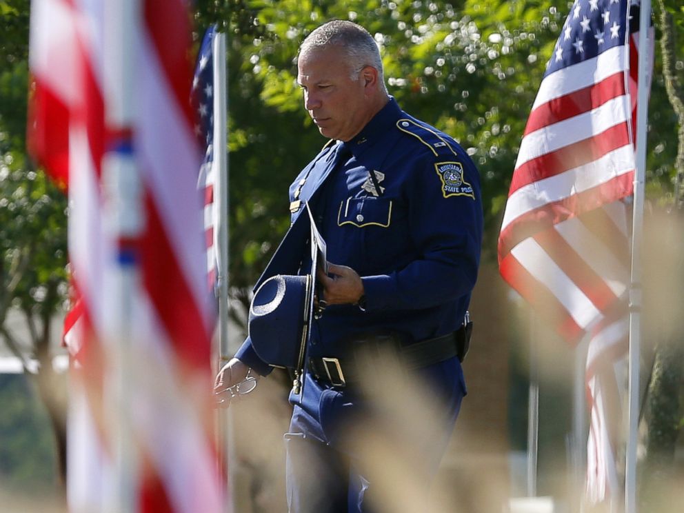 Trooper makes his way to a funeral services for police officer Matthew Gerald at Healing Place Church in Baton Rouge Louisiana