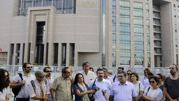 Journalists gather outside court to support their colleague journalist Bulent Mumay detained Tuesday