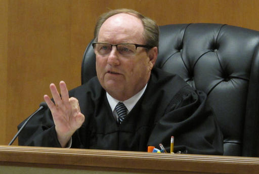 Shawnee County Kan. District Judge Larry Hendricks makes a comment during a hearing on requiring the state to count potentially thousands of votes in state and local elections from people who've registered without providing proof of their U.S. citizensh