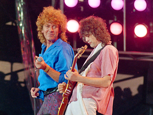 Led Zeppelin bandmates singer Robert Plant left and guitarist Jimmy Page reunite to perform for the Live Aid fam