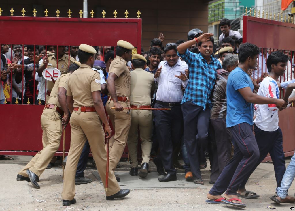 India Film Kabali Policemen try to maintain the order of the fans of Indian superstar Rajinikanth as they enter the premises of a cinema hall where the actor's new movie'Kabali is being screened in Chennai India Friday