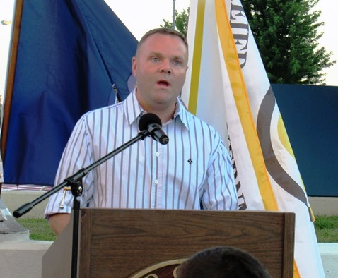 Dustin Dierenfeldt sang'Amazing Grace at the candlelight vigil for Capt. Robert David Melton held Wednesday night in front of Kansas CIty Kan. City Hall