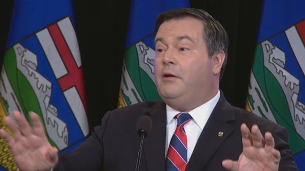 Jason Kenney speaks to reporters Thursday at the Matrix Hotel in Edmonton. He laid out his plan for uniting the Wildrose and Progressive Conservative parties in Alberta