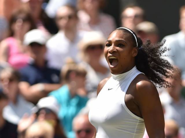 US player Serena Williams wins a point against Russia's Elena Vesnina during their women's semi-final match on the eleventh day of the 2016 Wimbledon Championships at The All England Lawn Tennis Club in Wimbledon southwest London