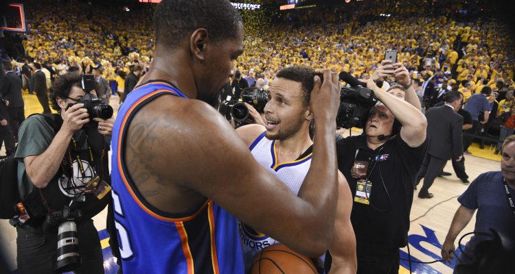 Oakland CA USA Golden State Warriors guard Stephen Curry is congratulated by Oklahoma City Thunder forward Kevin Durant after game seven of the Western conference finals of the NBA Playoffs at Oracle Arena. The Warriors