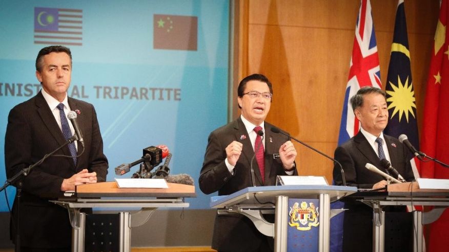 From left to right Australia's Minister for Infrastructure and Transport Darren Chester Malaysia's Minister of Transport Liow Tiong Lai and China's Minister of Transport from the People's Republic Yang Chuantang speak on the Malaysia