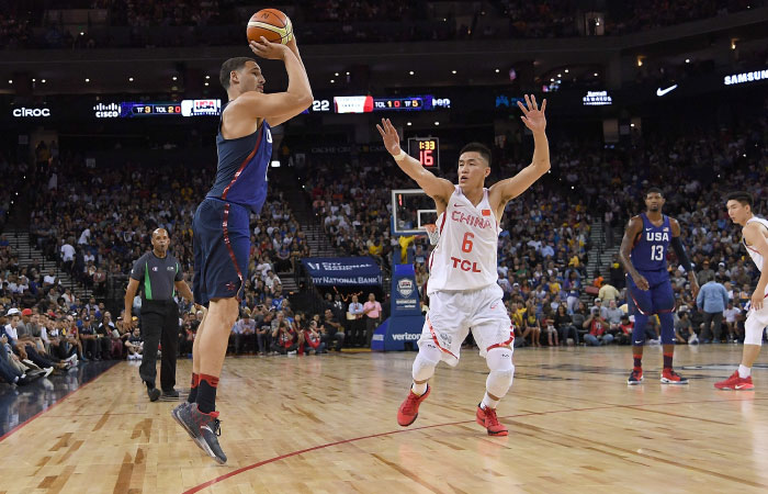 Klay Thompson of the United States shoots over Guo Ailun of China during an exhibition game at ORACLE Arena in Oakland Tuesday. — AFP