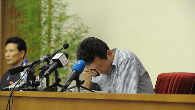 Ko Hyon Chol attends a press conference after being arrested on charges of child abduction in the People's Palace of Culture in Pyongyang