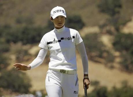 Sung Hyun Park of South Korea waves after making a birdie putt on the 16th green during the second round of the U.S. Women's Open golf tournament at CordeValle Friday