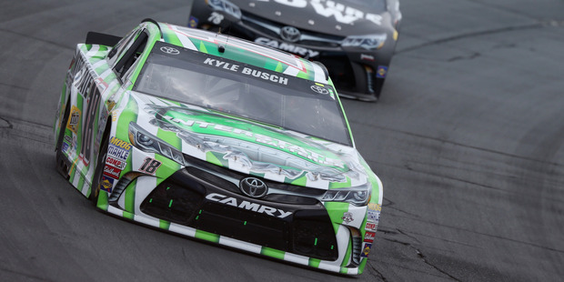 Kyle Busch leads Martin Truex Jr during the NASCAR Sprint Cup Series New Hampshire 301