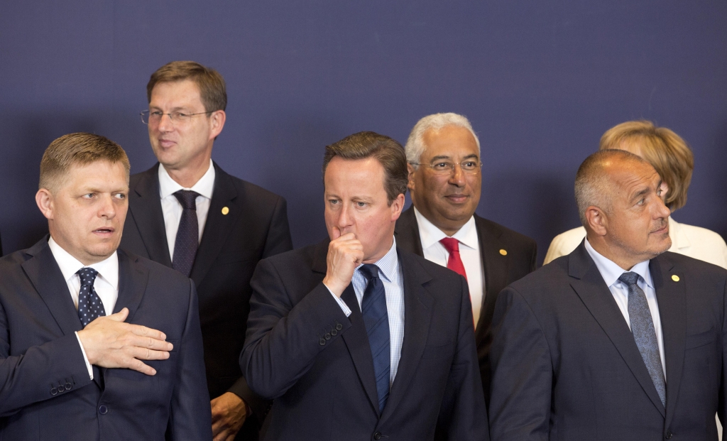 British Prime Minister David Cameron center waits for the start of a group