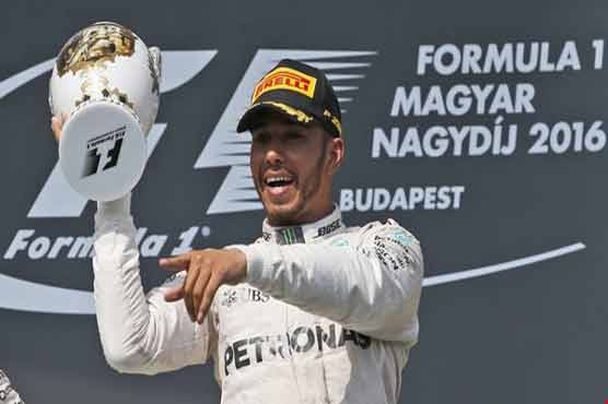 Lewis Hamilton won Hungarian Grand Prix climbing above Nico Rosberg atop the drivers standings