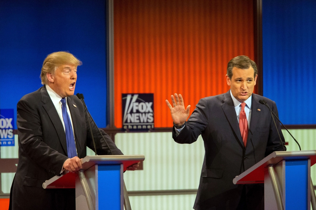 TOPSHOT- Republican Presidential candidates Ted Cruz and Donald Trump spar during the Republican Presidential Debate in Detroit Michigan