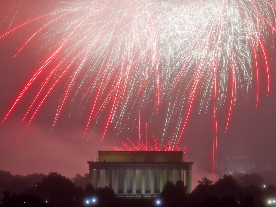 Fireworks explode over Lincoln Memorial at the National Mall as seen from Arlington Va. during the Fourth of July celebration on Monday