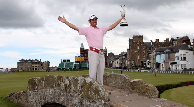 ST ANDREWS SCOTLAND- JULY 19 Open Champion Louis Oosthuizen of South Africa poses with the Claret Jug on the Swilken bridge