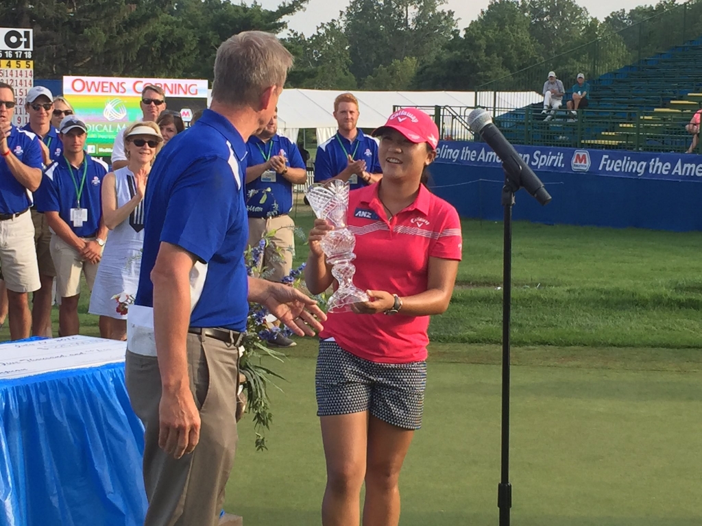 Lydia Ko accepts the trophy for winning her second Marathon Classic