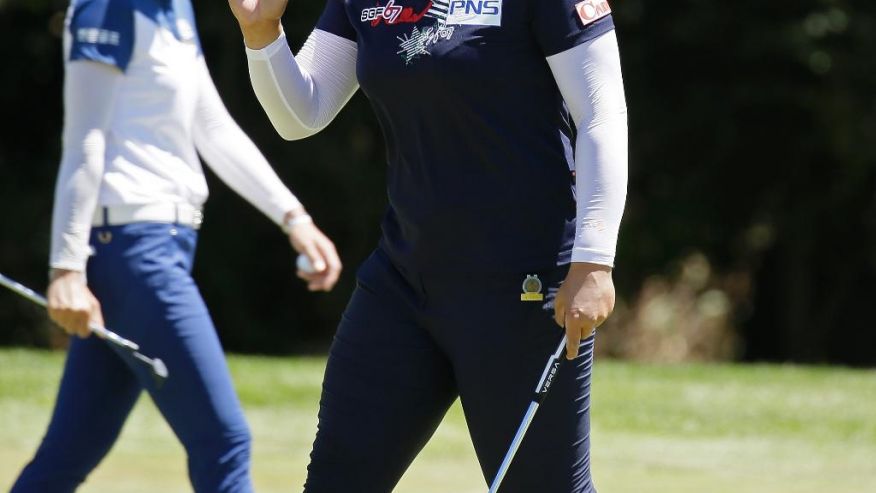 Amy Yang of South Korea waves after making a birdie putt on the sixth green during the third round of the U.S. Women's Open golf tournament at Corde Valle Saturday