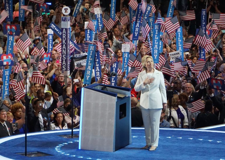 Hillary Clinton acknowledges sustained applause as she accepts the nomination to be president