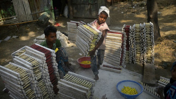 MUNIR UZ ZAMAN  AFP  Getty Images A child working at a factory in Dhaka Bangladesh