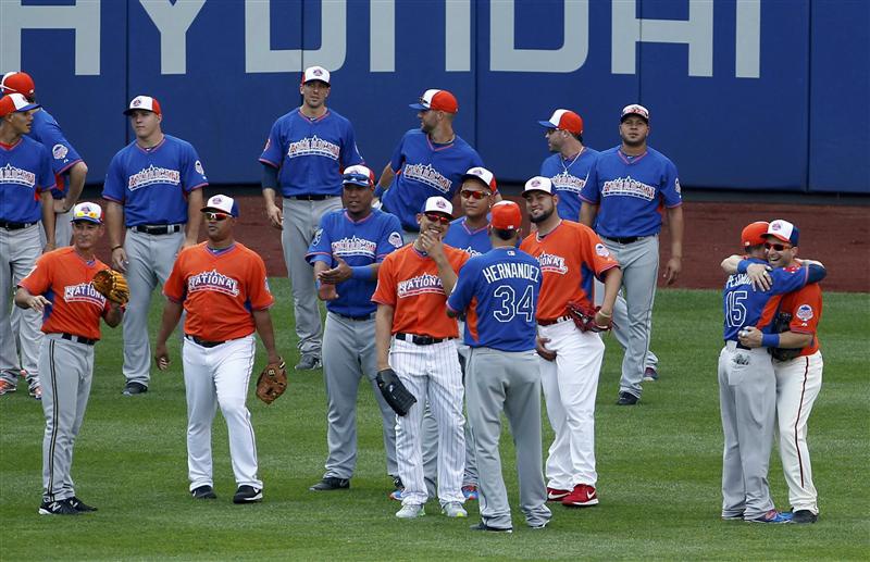 Major League All Stars greet one another in the outfield during practice before the Major League Baseball All Star Game Home Run Derby in Ne