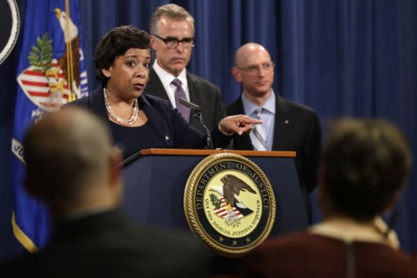 Attorney General Loretta Lynch left next to FBI