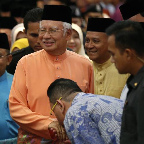 Minister Najib Razak center arrives for an Eid al Fitr open house event in Kuala Lumpur Malaysia Thursday