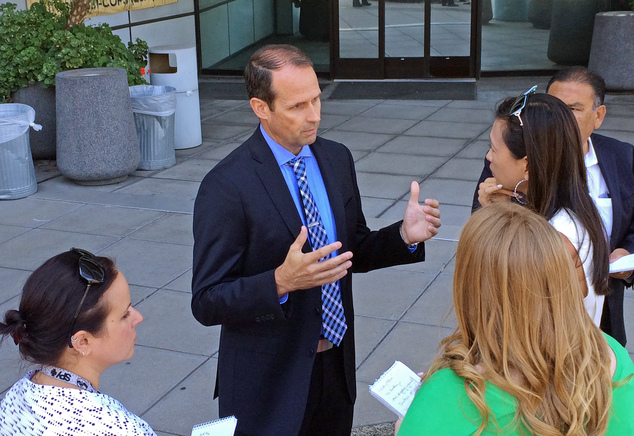 San Diego police Capt. David Nisleit talks with reporters about a recent spate of early-morning attacks on homeless people who were sleeping alone and in