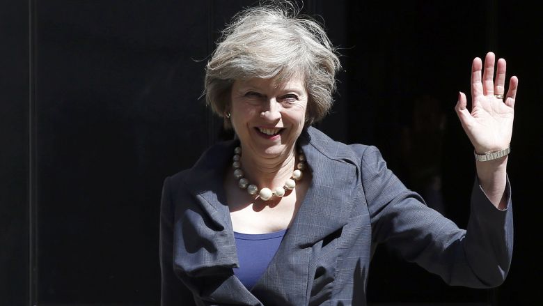 Britain's Home Secretary Theresa May who is due to take over as prime minister on Wednesday waves as she leaves after a cabinet meeting at number 10 Downing Street in central London Britain