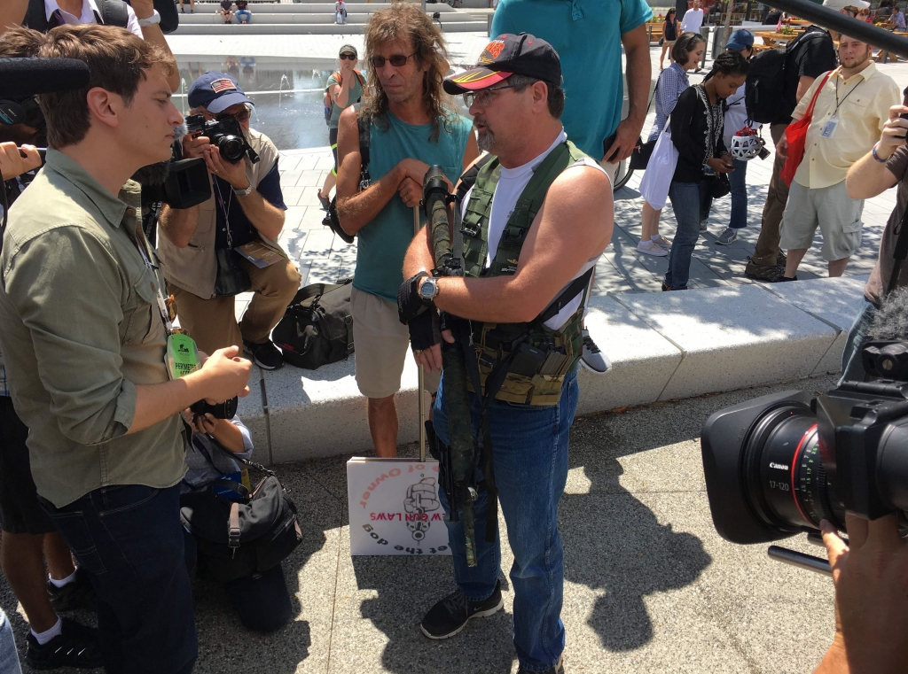 US-VOTE-REPUBLICANS-CONVENTION-GUNS-10 Steve Thacker center 57 an IT engineer carries an AR-style weapon during an open carry event today in Cleveland site of the Republican National Convention