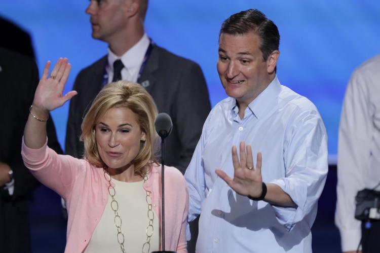 Sen. Ted Cruz and wife Heidi wave from the podium during a sound check before the third day of the Republican National Convention in Cleveland