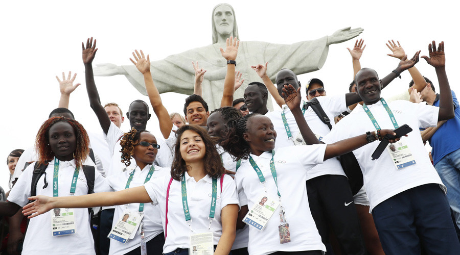 Members of the Olympic refugee team pose in front of Christ the Redeemer