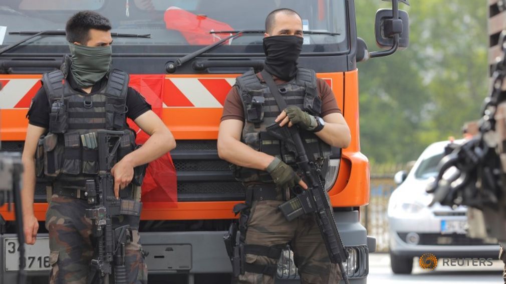 Members of the police special forces stand guard in front of the Air Force Academy in Istanbul Turkey