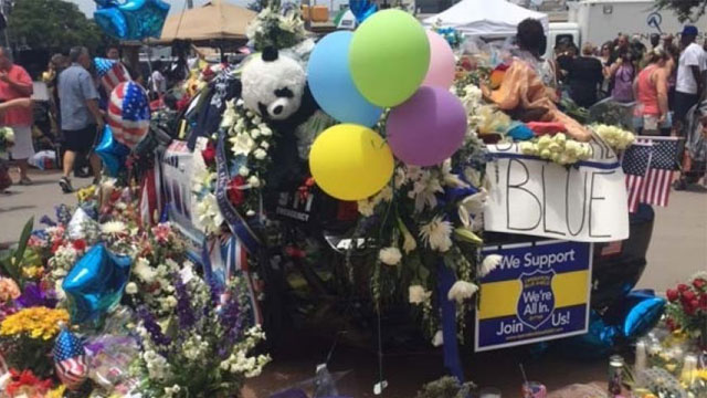 Memorial for five fallen officers outside Dallas Police Head Quarters