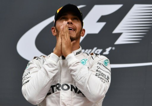 Mercedes driver Lewis Hamilton celebrates victory in the Austrian Grand Prix